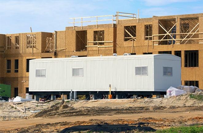 construction workers discussing plans in a rental office in Delray Beach, FL